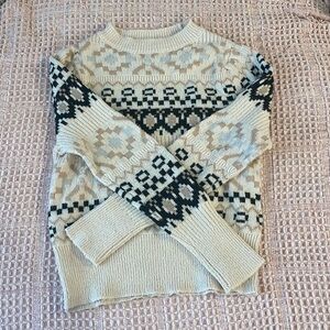 Tan patterned sweater.